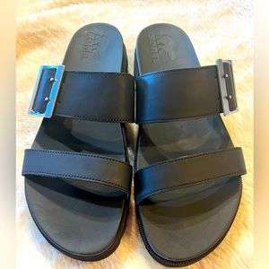 NWOB- Women’s Sorel Black Slides.           Size 10 1/2